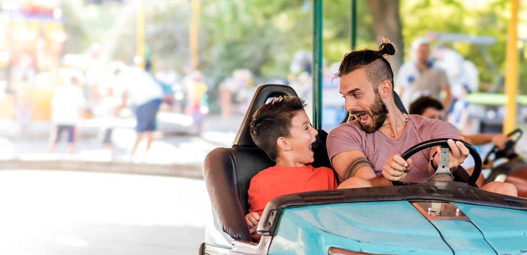 Dad and son at amusement park